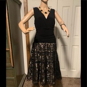 Ladies V-neckline sleeveless gold w/ black lace overlay skirt. Size 16.